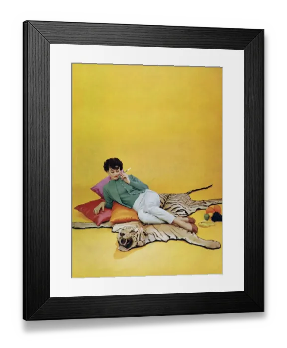 Framed Print : Lyle and Scott 1950s UK womens knitwear woman tigers skin rugs Framed Print : Lyle and Scott 1950s UK womens knitwear woman tigers skin rugs