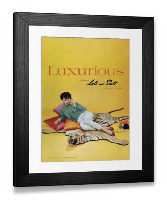 Framed Print : Lyle and Scott 1950s UK womens knitwear woman tiger skin rugs Framed Print : Lyle and Scott 1950s UK womens knitwear woman tiger skin rugs