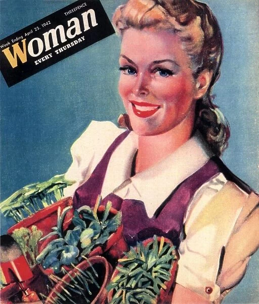 Woman 1942 1940s UK land girls dig for victory propaganda growing vegetables WW2