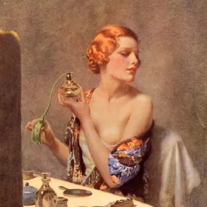1930s UK perfume woman doing her make-up budoir putting on perfume atomisers makeup