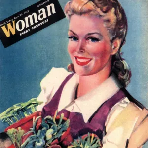 Woman 1942 1940s UK land girls dig for victory propaganda growing vegetables WW2