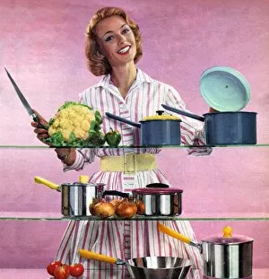 Nineteen Sixties Collection: Happy Housewife in Kitchen 1960s UK pans pots housewives