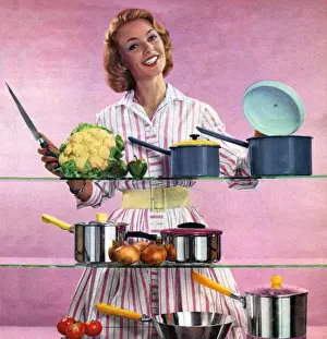 Happy Housewife in Kitchen 1960s UK pans pots housewives