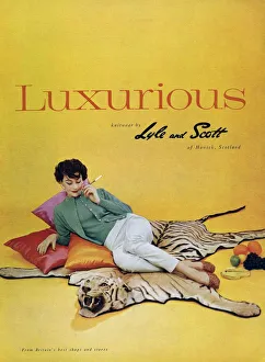 1950s Prints: Lyle and Scott 1950s UK womens knitwear woman tiger skin rugs