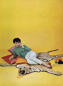 Womens Prints: Lyle and Scott 1950s UK womens knitwear woman tigers skin rugs